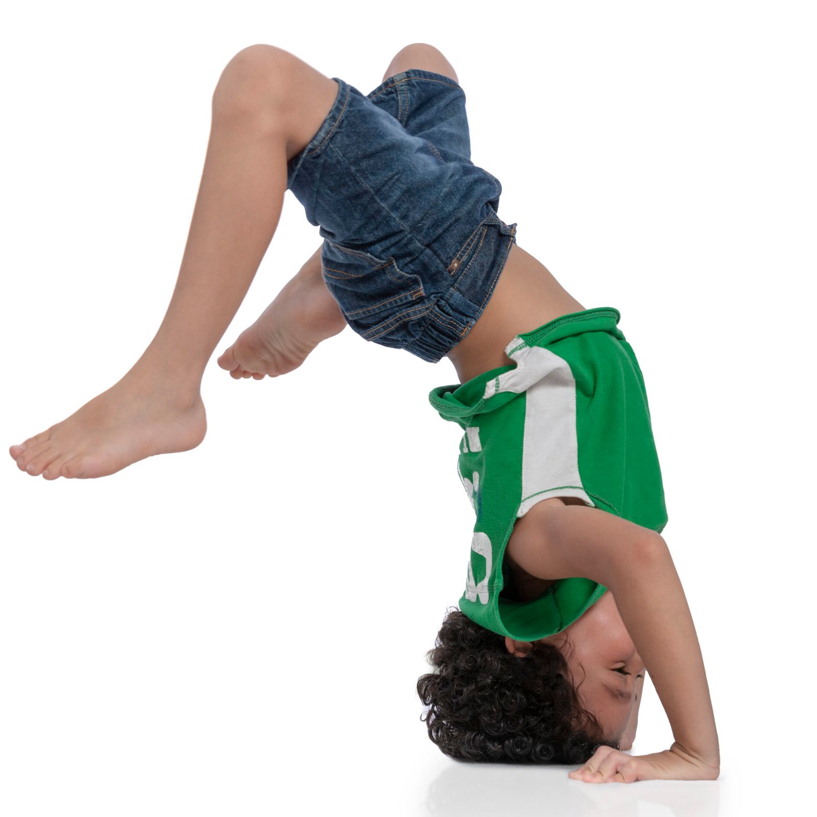 Active Joyful Boy Balancing on His Hands and Head