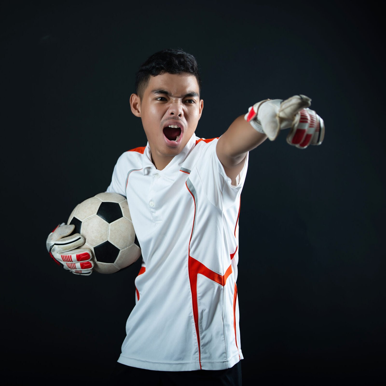 Young goalkeeper soccer man isolated of academy soccer team