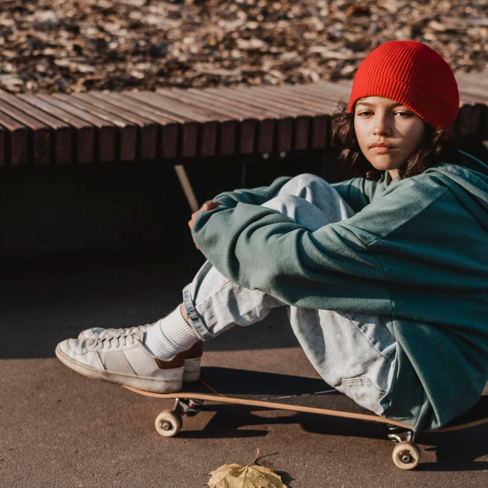 side-view-teenager-with-skateboard-outside